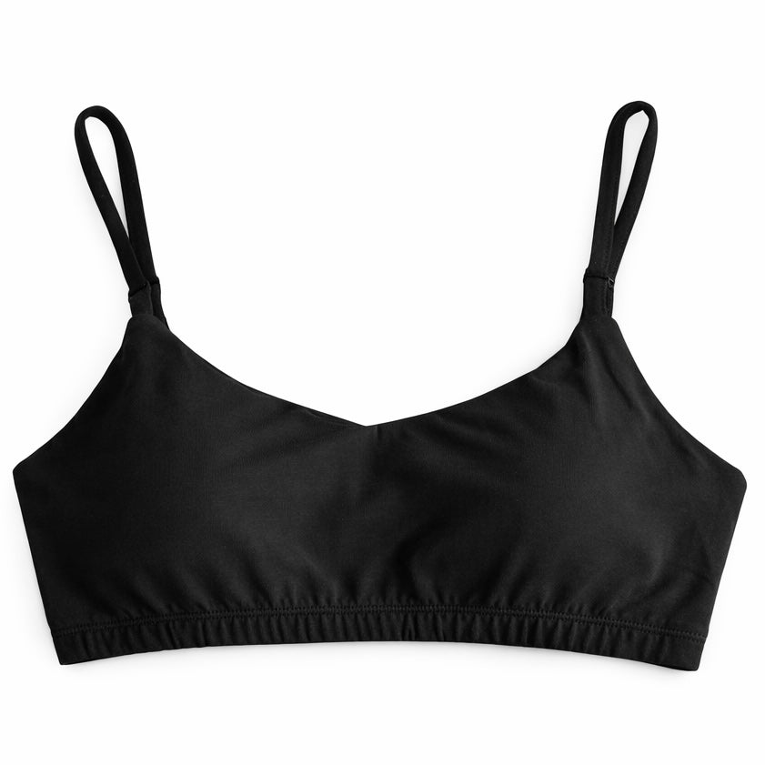 Black crop top with thin straps on a white background