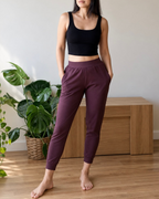 woman wearing black bamboo crop top and chocolate plum jogger pants 