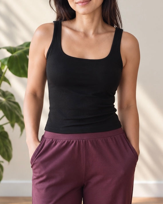 woman wearing black square neck tank and plum pants
