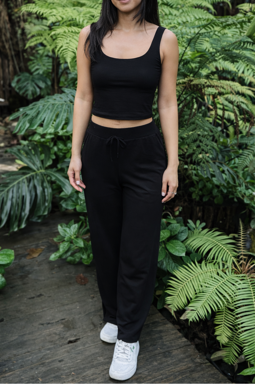 women wearing tank top and pants in garden